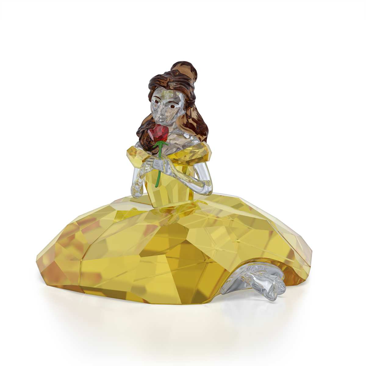 Crystal figure of a character in a yellow dress holding a rose on a white background
