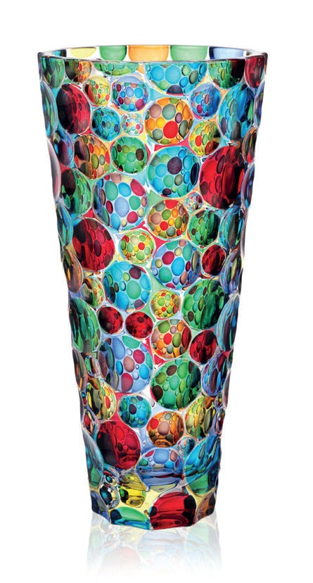 Multicolored glass vase with bubble pattern on a white background