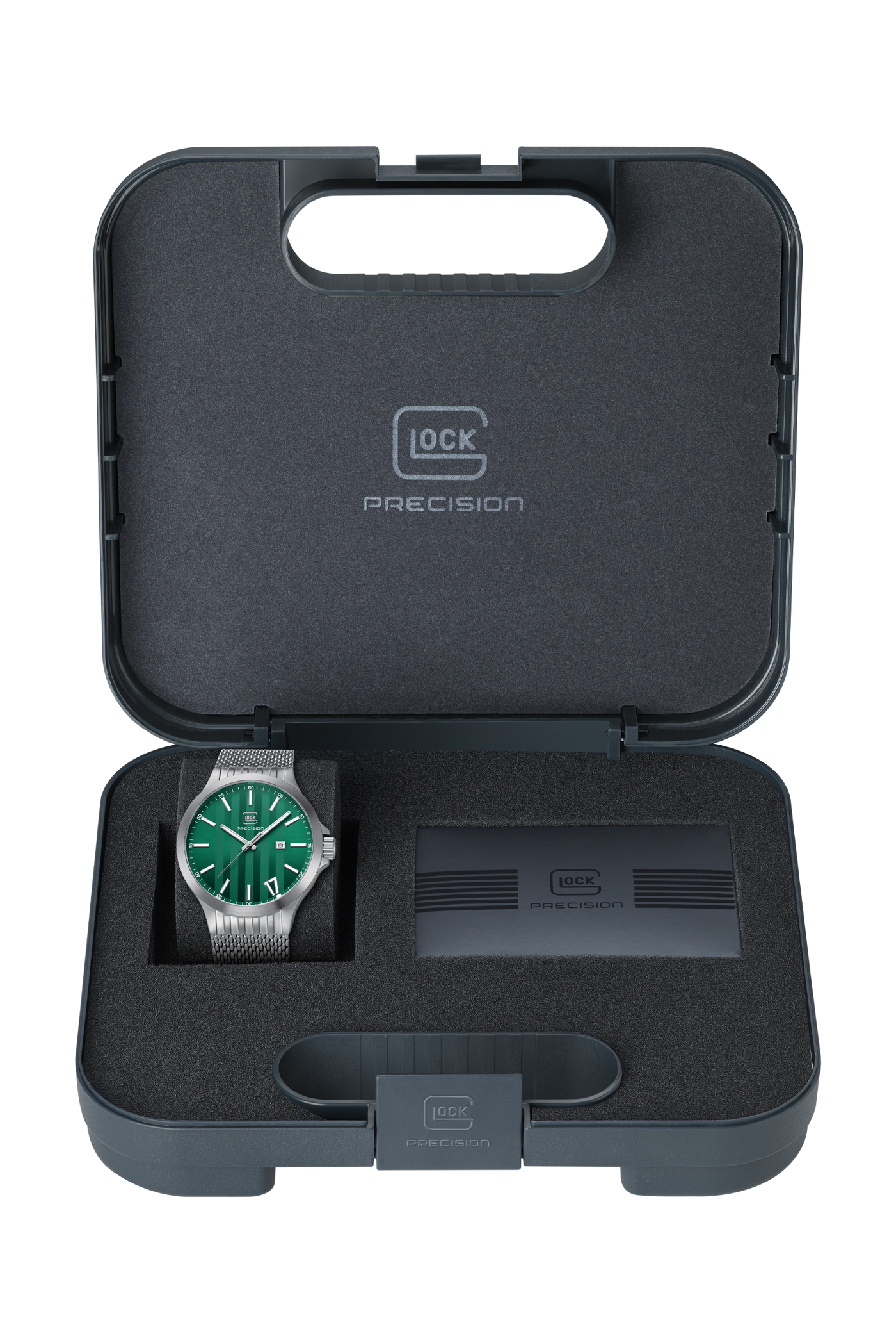 A Glock Precision watch with a green dial and silver mesh case, presented inside an open dark gray foam presentation case with a branded Glock interior.
