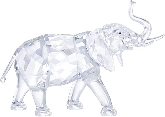 A clear crystal figurine of an elephant with a diamond-patterned surface.