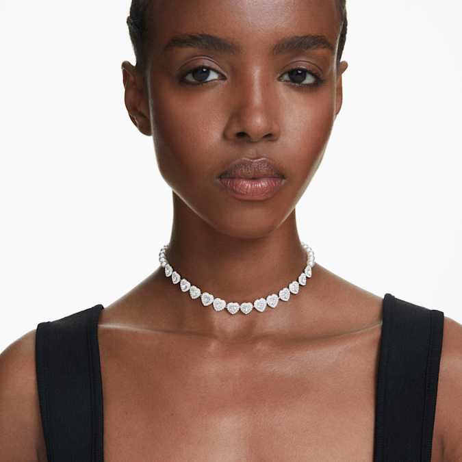 A model is wearing Ariana Grande x Swarovski Tennis choker Mixed cuts, Heart, White, Rhodium plated