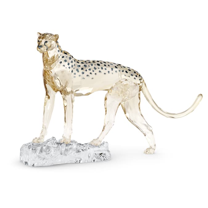 A gold-tone cheetah figurine on a crystal base, part of the Elegance of Africa collection.