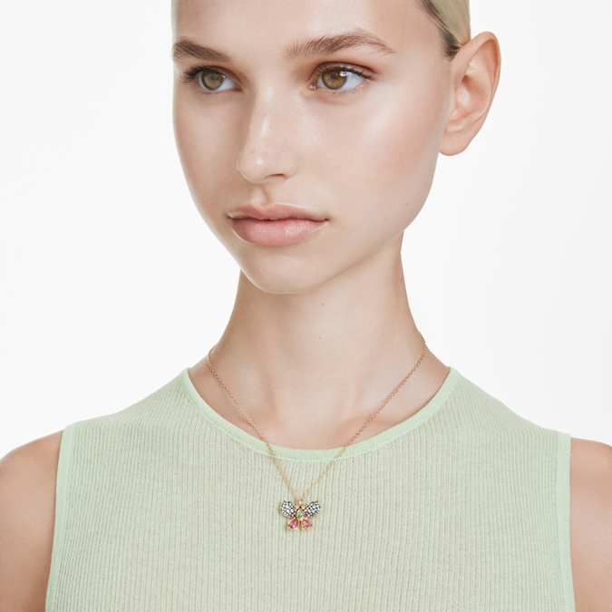 A model wearing gold tone butterfly necklace.