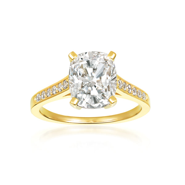 A cushion cut ring with a total weight of 3.70 carats, set in a yellow gold plated.