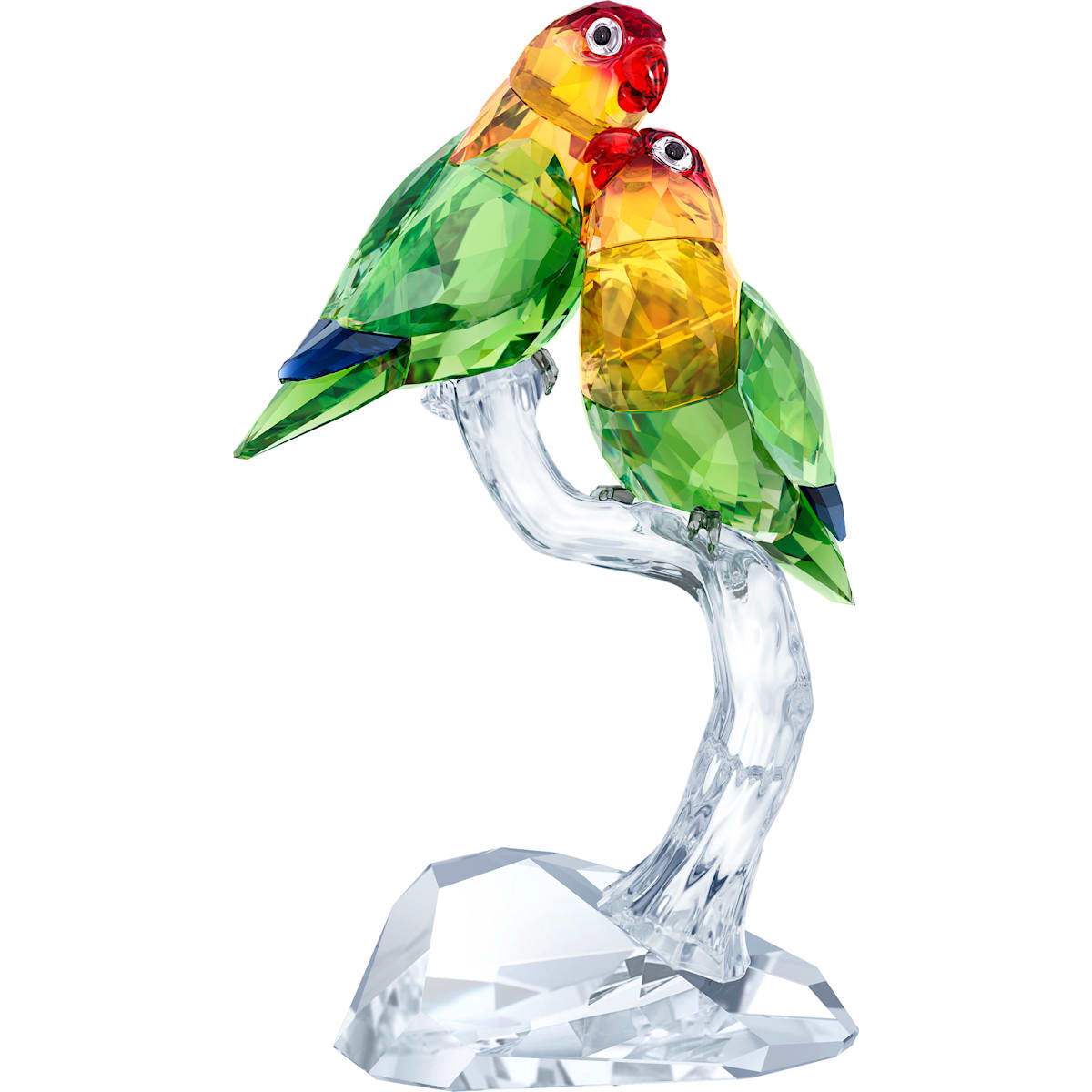 A crystal figurine of two multicolored lovebirds perched on a branch, crafted by Swarovski.