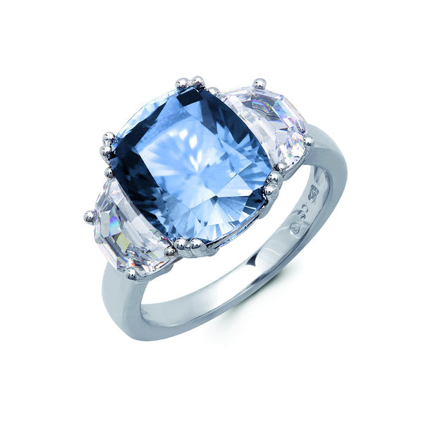 A blue Cubic Zirconia cocktail ring finished in pure platinum, featuring a central blue quartz stone surrounded by smaller clear quartz pieces, set in a silver-colored band.