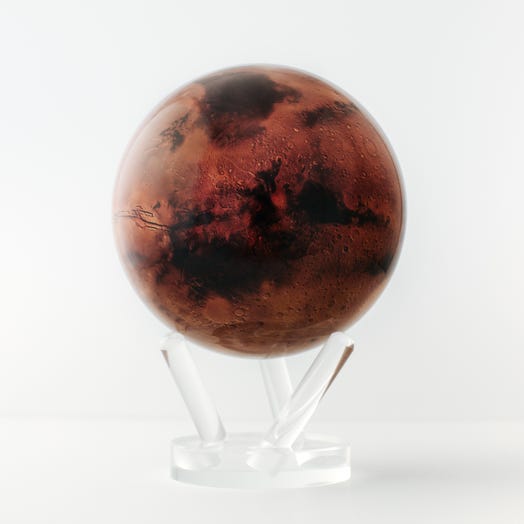 A rotating globe of Mars with a realistic surface texture on a clear stand, powered by hidden magnets using ambient light.