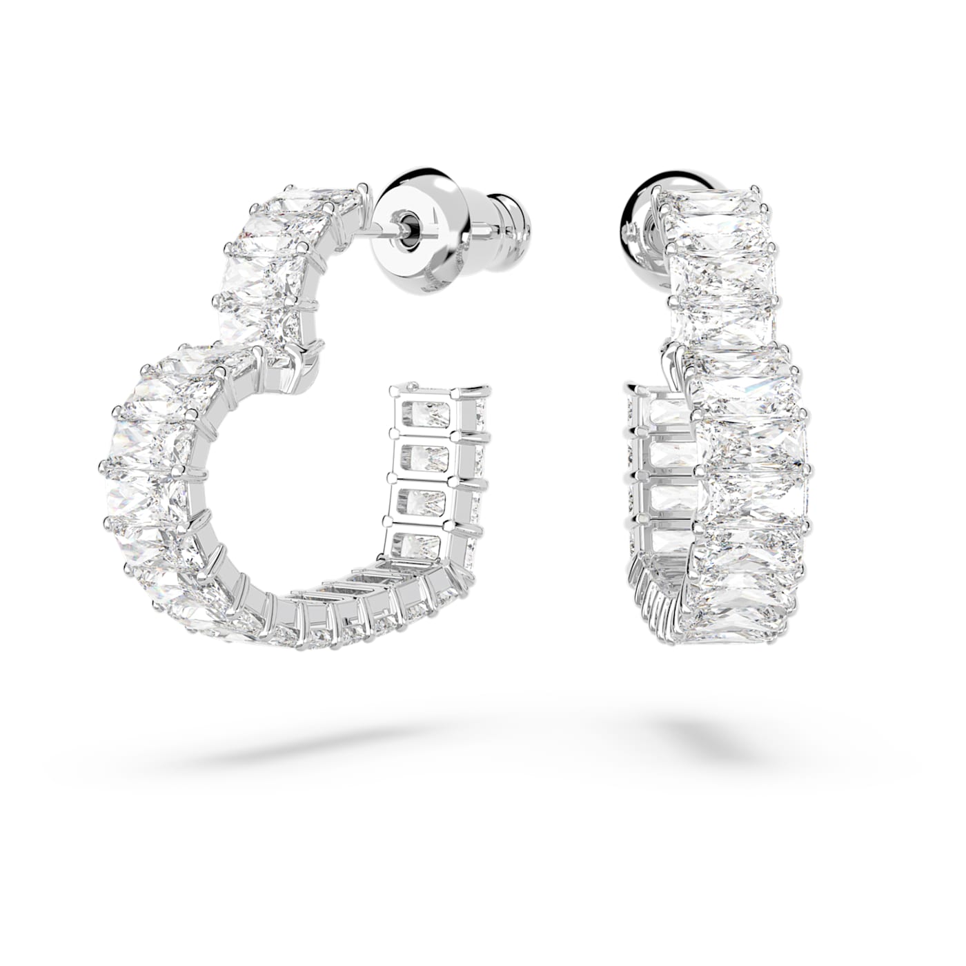 A pair of white, rhodium-plated hoop earrings embellished with heart-shaped crystals.