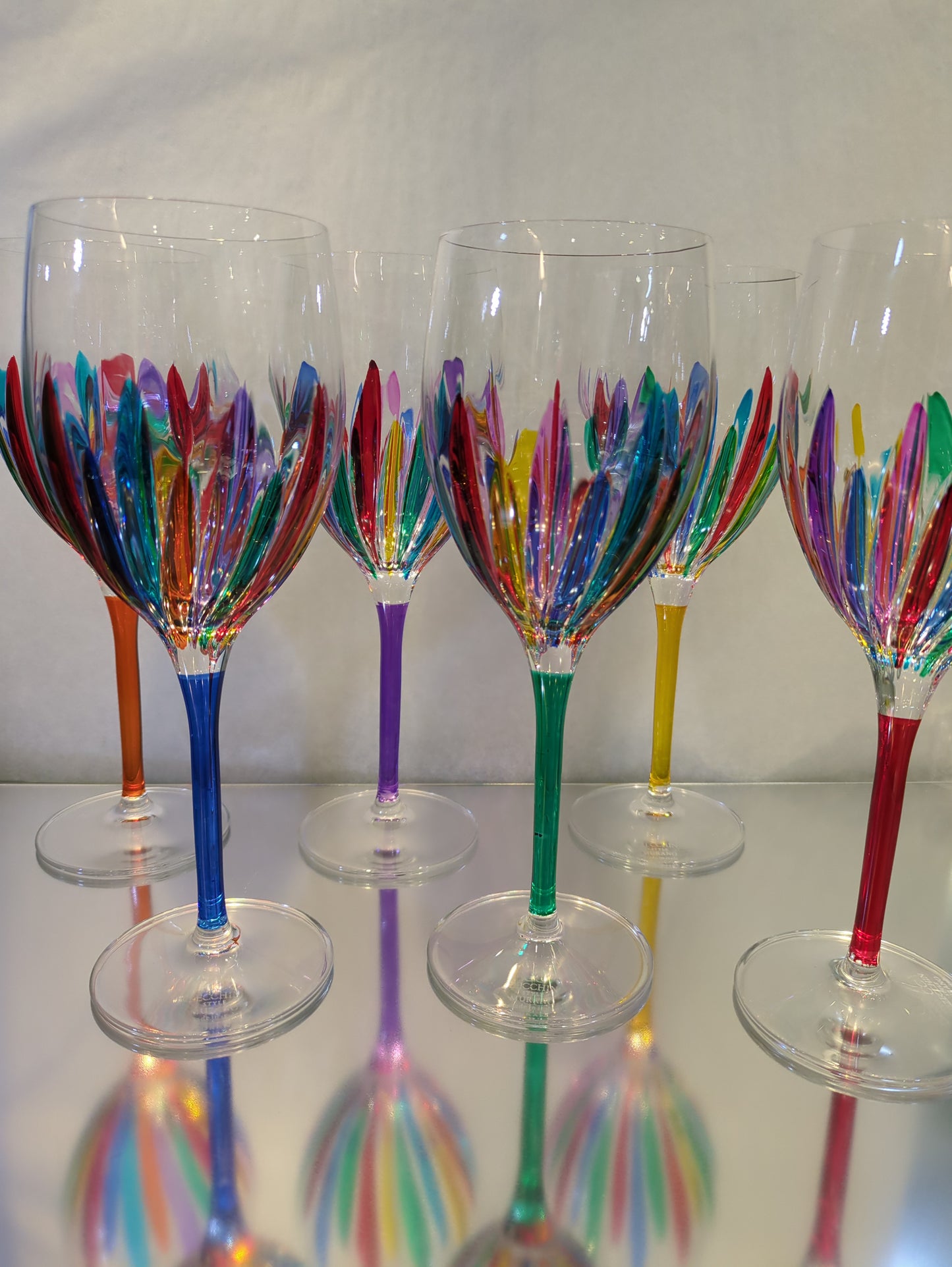 A set of multicolored wine glasses .