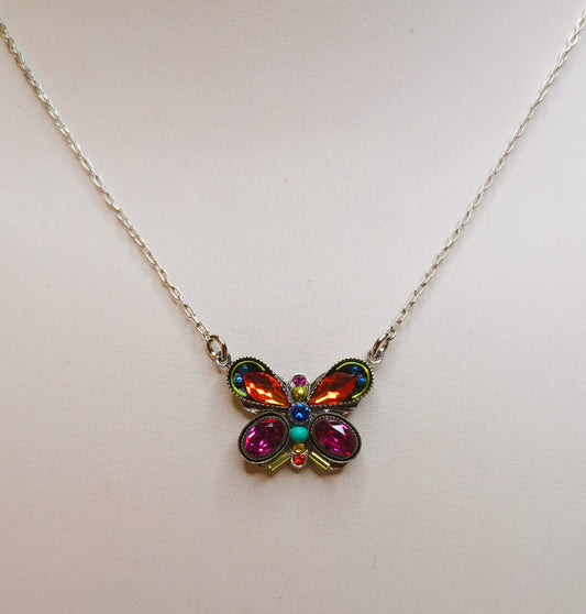 A colorful butterfly-shaped necklace with multicolored crystals and an antiqued steel chain.
