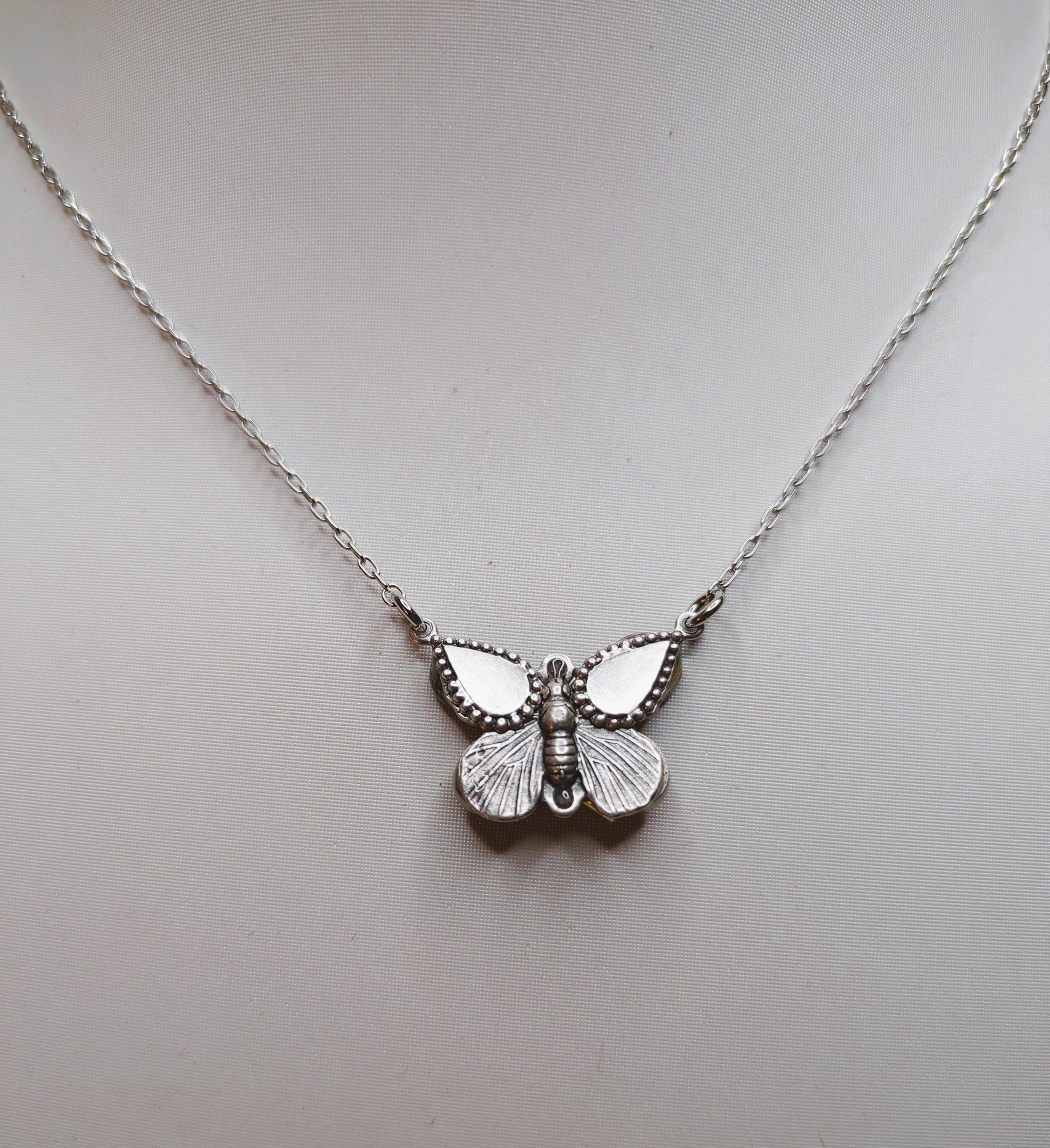 A back view of butterfly necklace.