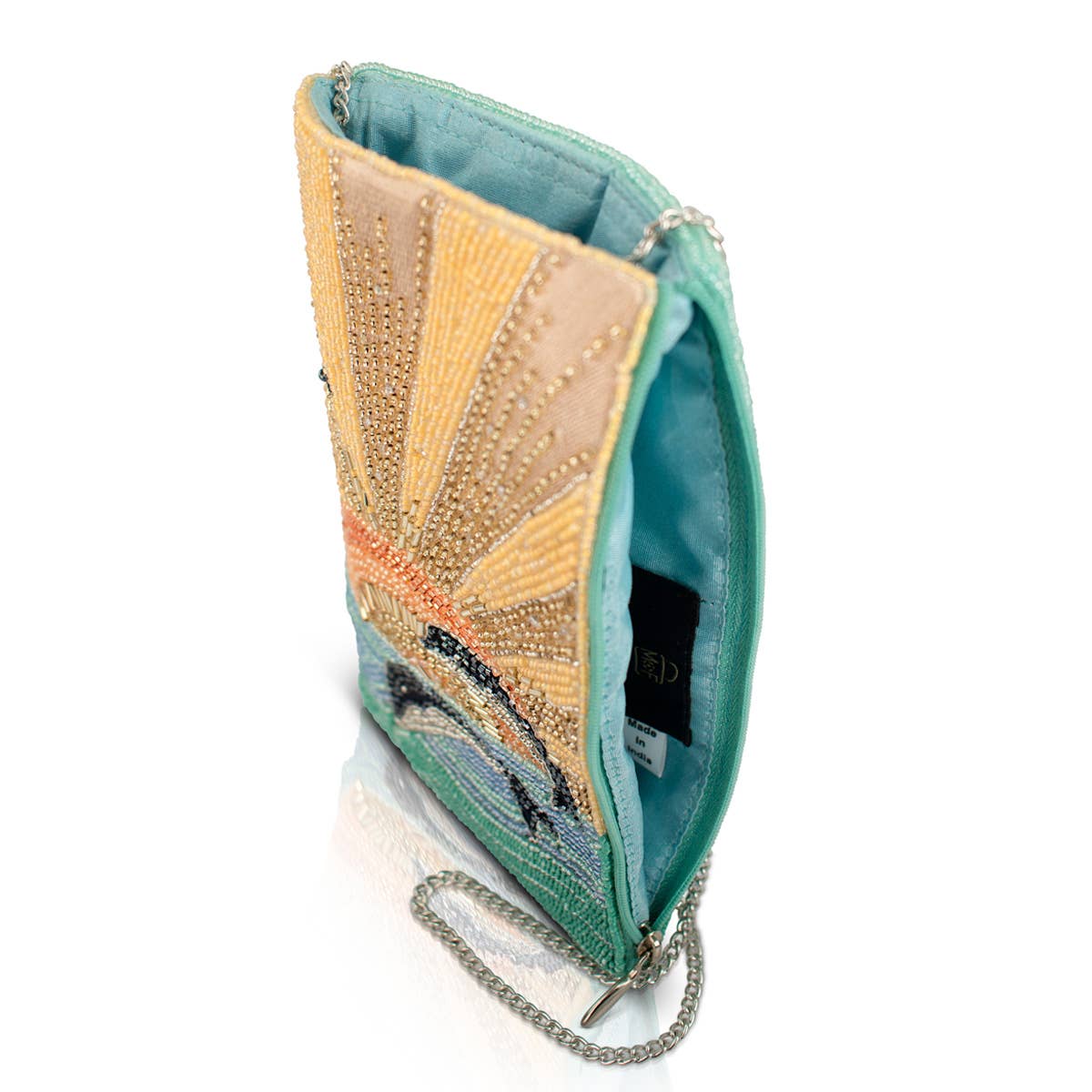 Decorative clutch bag with beaded design on a white background