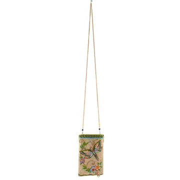 A bag with a dragonfly design on a white background