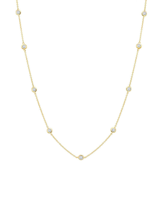 A 36-inch gold-tone necklace with bezel set cubic zirconia stones.