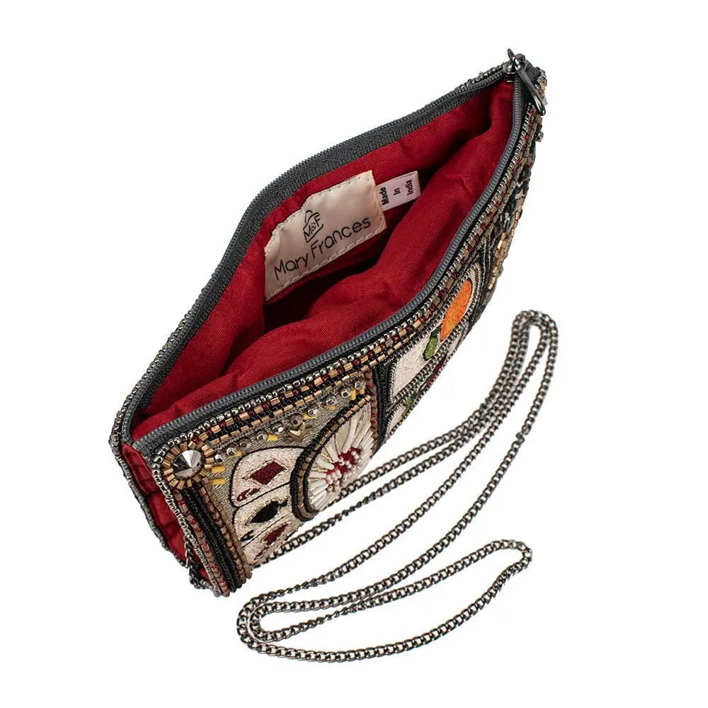 A beaded crossbody phone bag designed to resemble a slot machine with various symbols, including cards and fruits, displayed on the front.