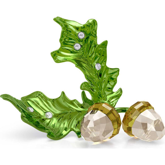 A green crystal figurine of an acorn with a pair of acorns next to it, adorned with Swarovski crystals.