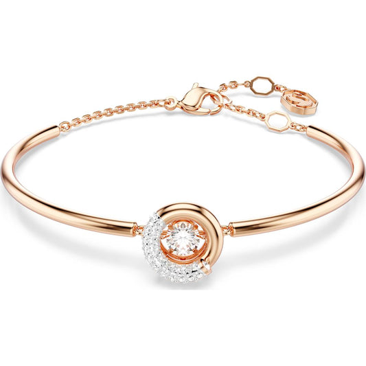 A white and rose gold-tone plated bangle bracelet with a round cut crystal centerpiece and adjustable chain.