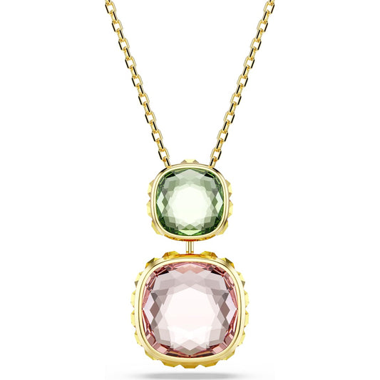 A gold-tone plated Chroma Twist pendant with a green and pink reversible design, featuring Swarovski Recreated crystals.