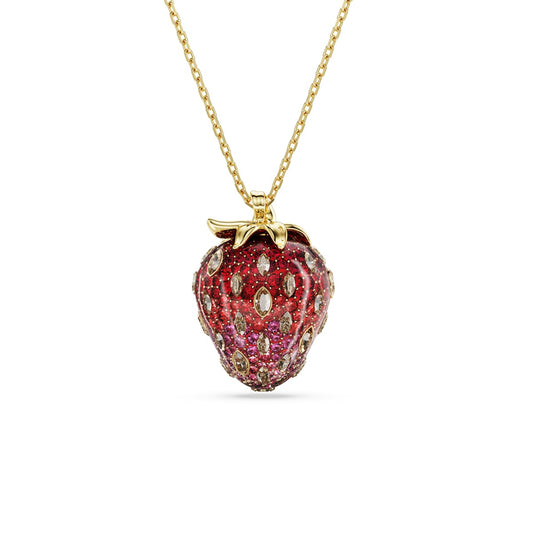 Strawberry-shaped pendant with red and pink gemstones on a gold tone chain against a white background