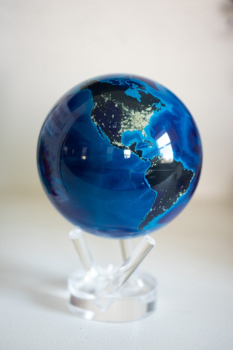 A 6-inch MOVA globe depicting the Earth at night on close up view.