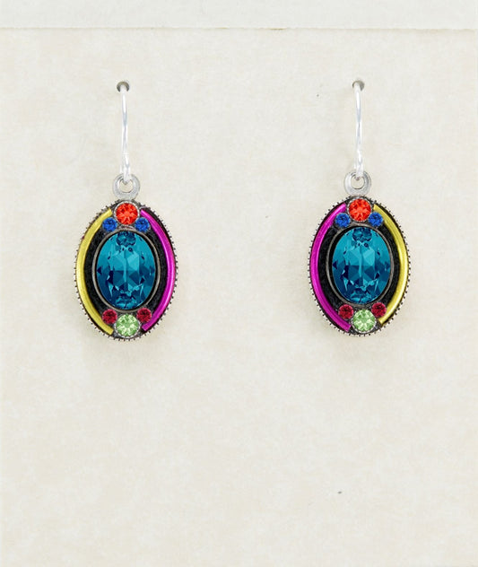 Pair of earrings with blue gemstones and colorful accents on a light background
