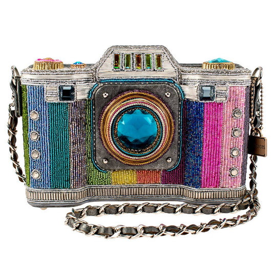 Colorful camera-shaped handbag with a chain strap on a white background