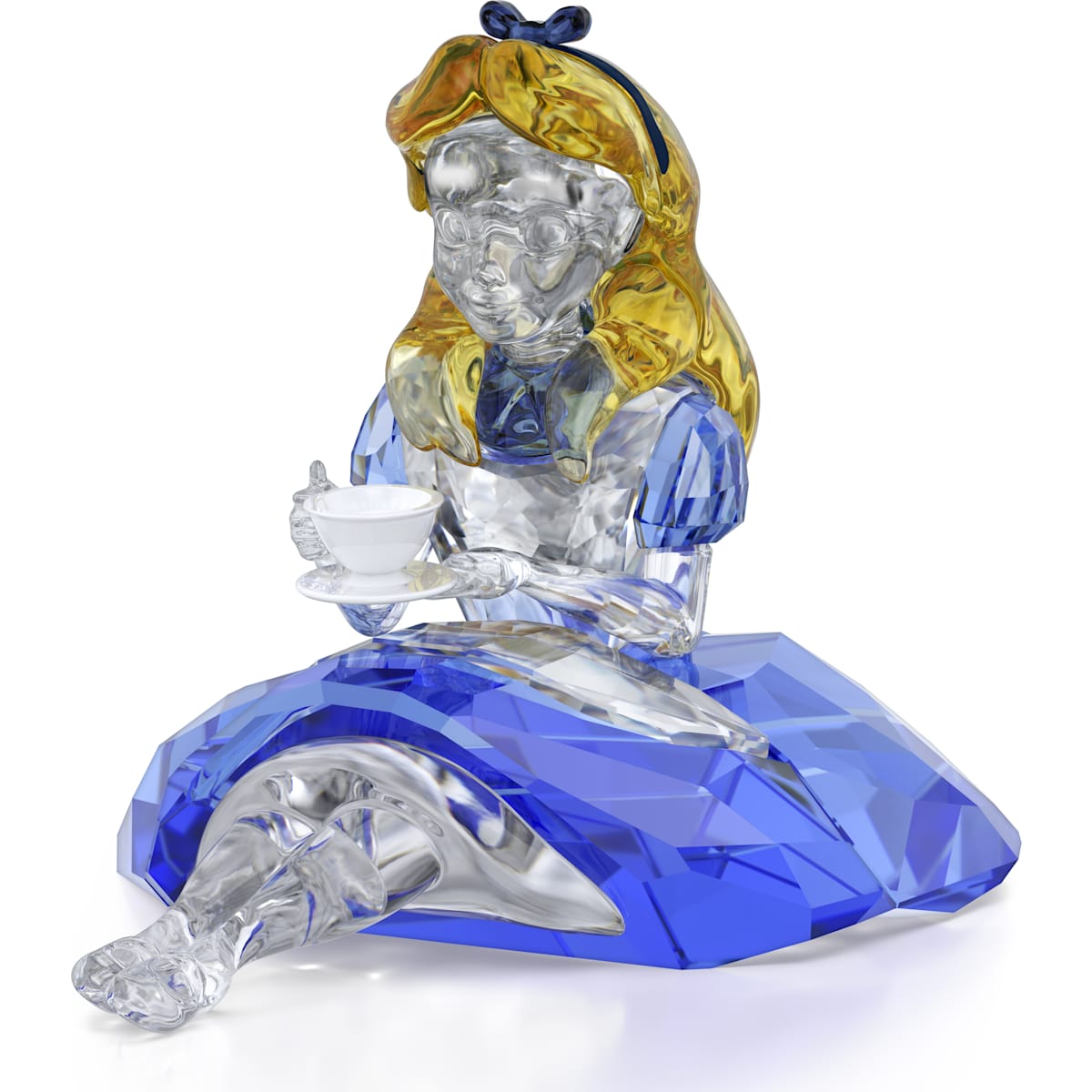 A crystal figurine of Alice from Alice in Wonderland, sitting and holding a cup, with a blue dress and yellow hair.