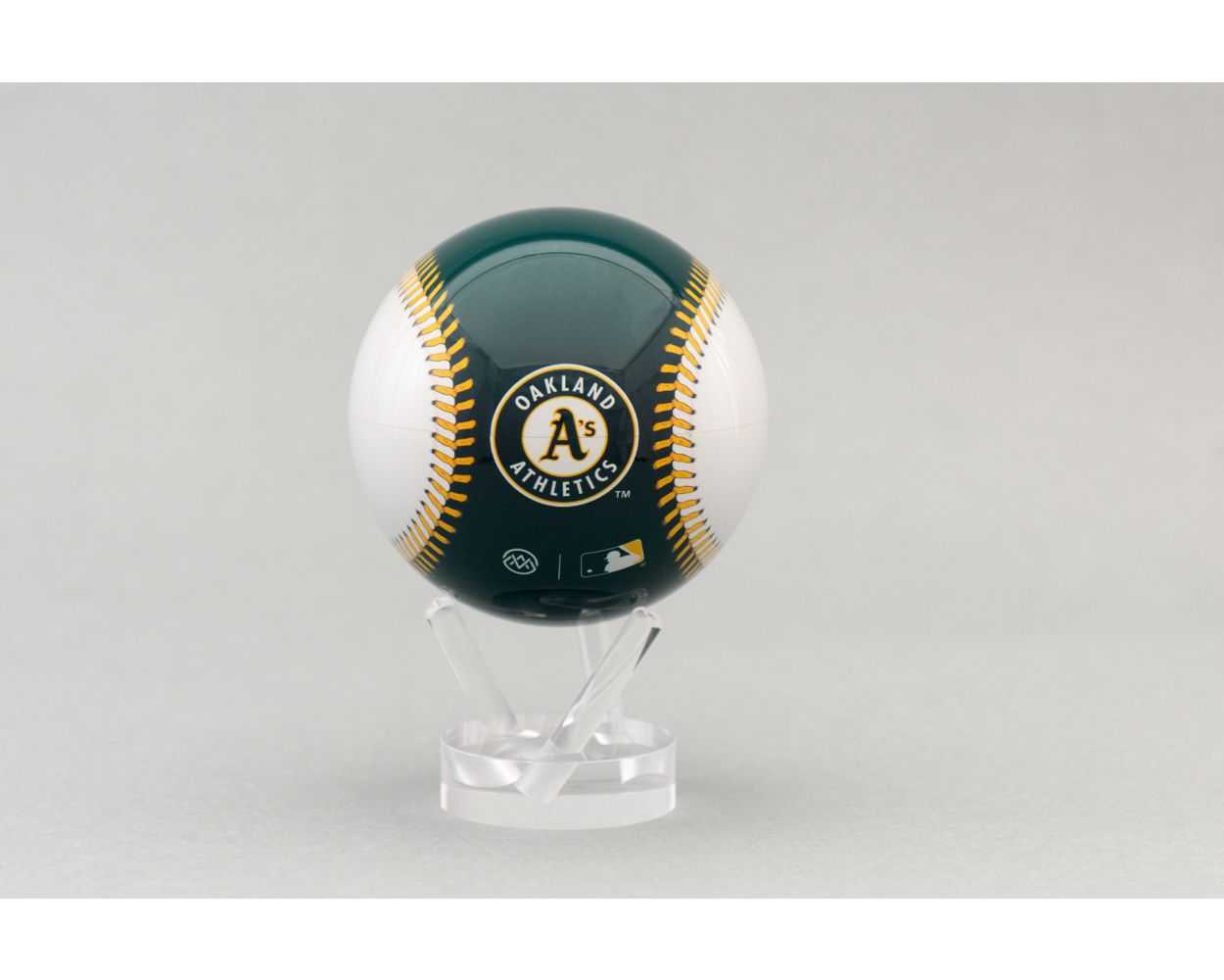 A 4.5 inch MOVA globe featuring an Oakland Athletics baseball design, sitting on a clear stand.