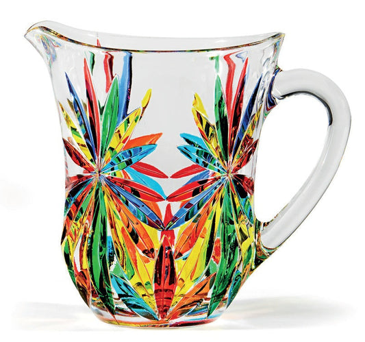 A multicolored glass pitcher with a geometric floral pattern