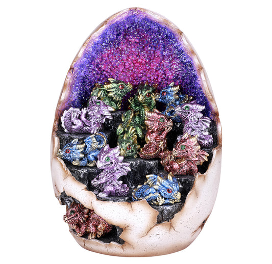 Decorative stone with colorful dragon figurines inside a geode-like structure on a white background