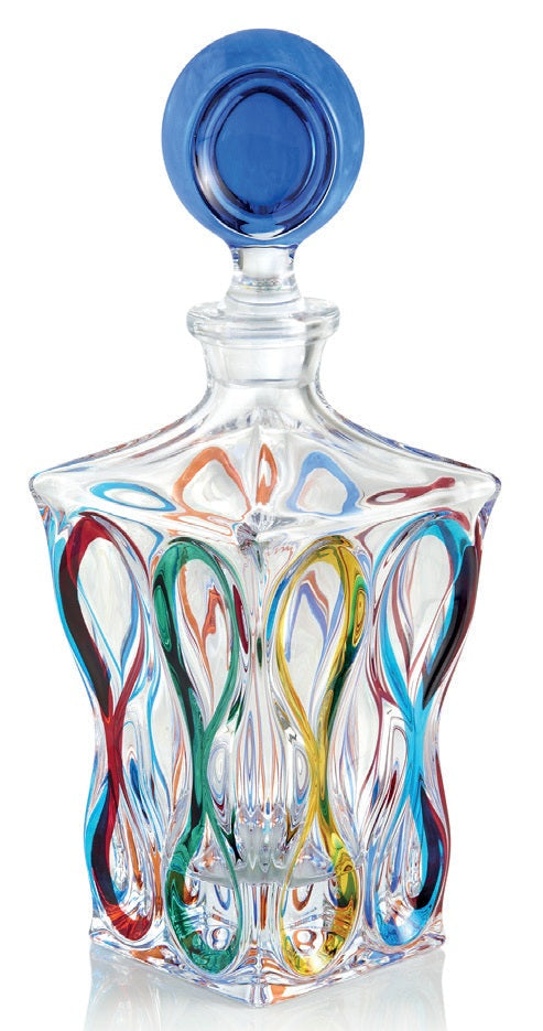 Colorful glass decanter with a blue stopper on a white background