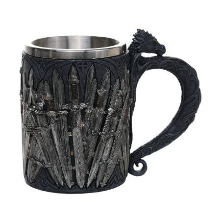 Decorative mug with sword design and dragon handle on a white background