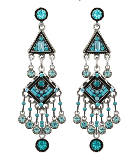 Pair of chandelier earrings with turquoise gemstones on a white background