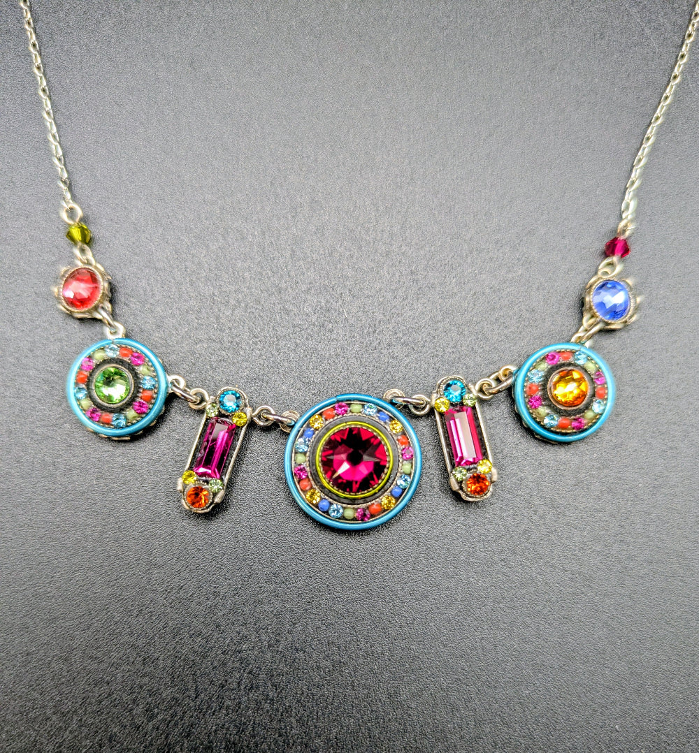 Multi color Firefly necklace on black background.