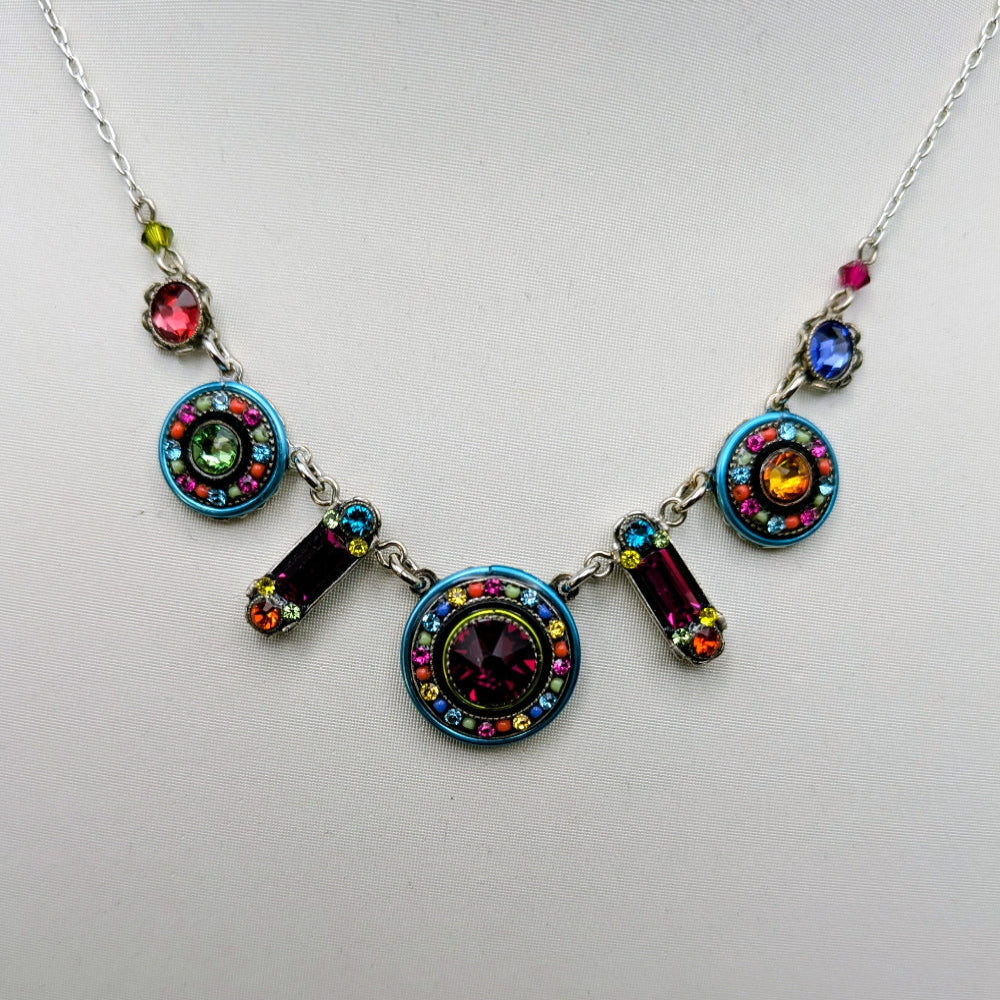 Multi color Firefly necklace on White background.