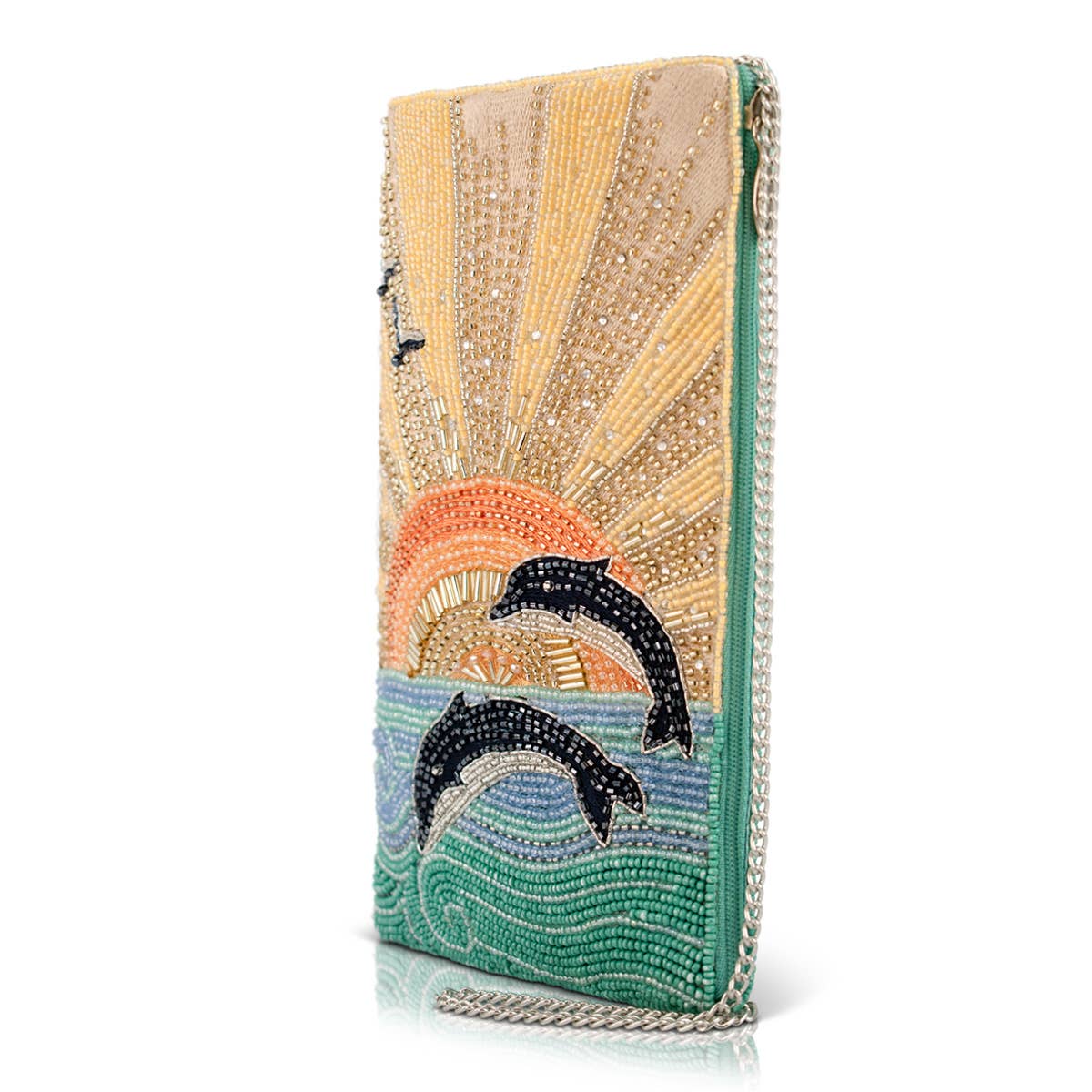 Decorative clutch with dolphins and sunset design on a white background
