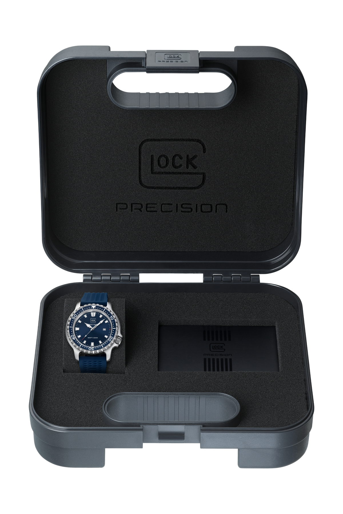 A precision watch with a blue dial and bezel is displayed inside an open gray protective carrying case with black foam insert. The brand name 'GLOCK PRECISION' is embossed on the inside lid.