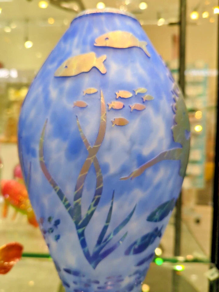 Decorative vase with underwater scene design featuring fish and plants.