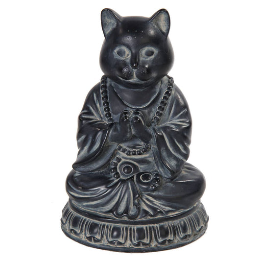 Black cat figurine in a meditative pose on a white background