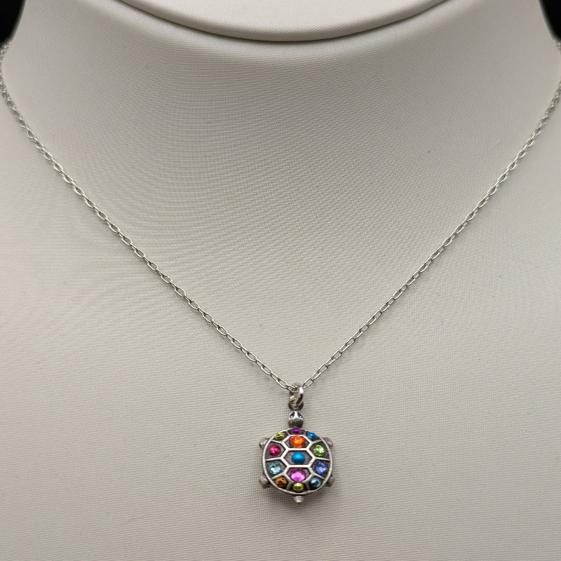 Necklace with a colorful pendant on a mannequin bust