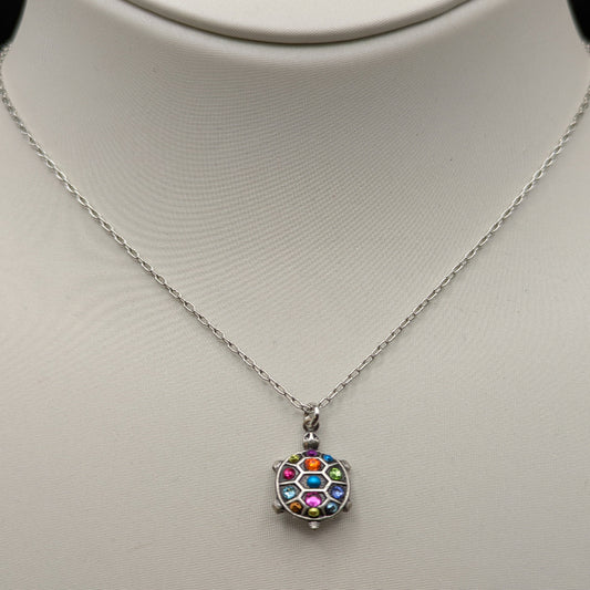 Necklace with a colorful pendant on a mannequin bust