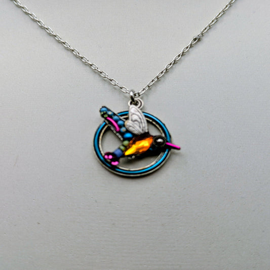 Necklace with a colorful pendant on a gray background