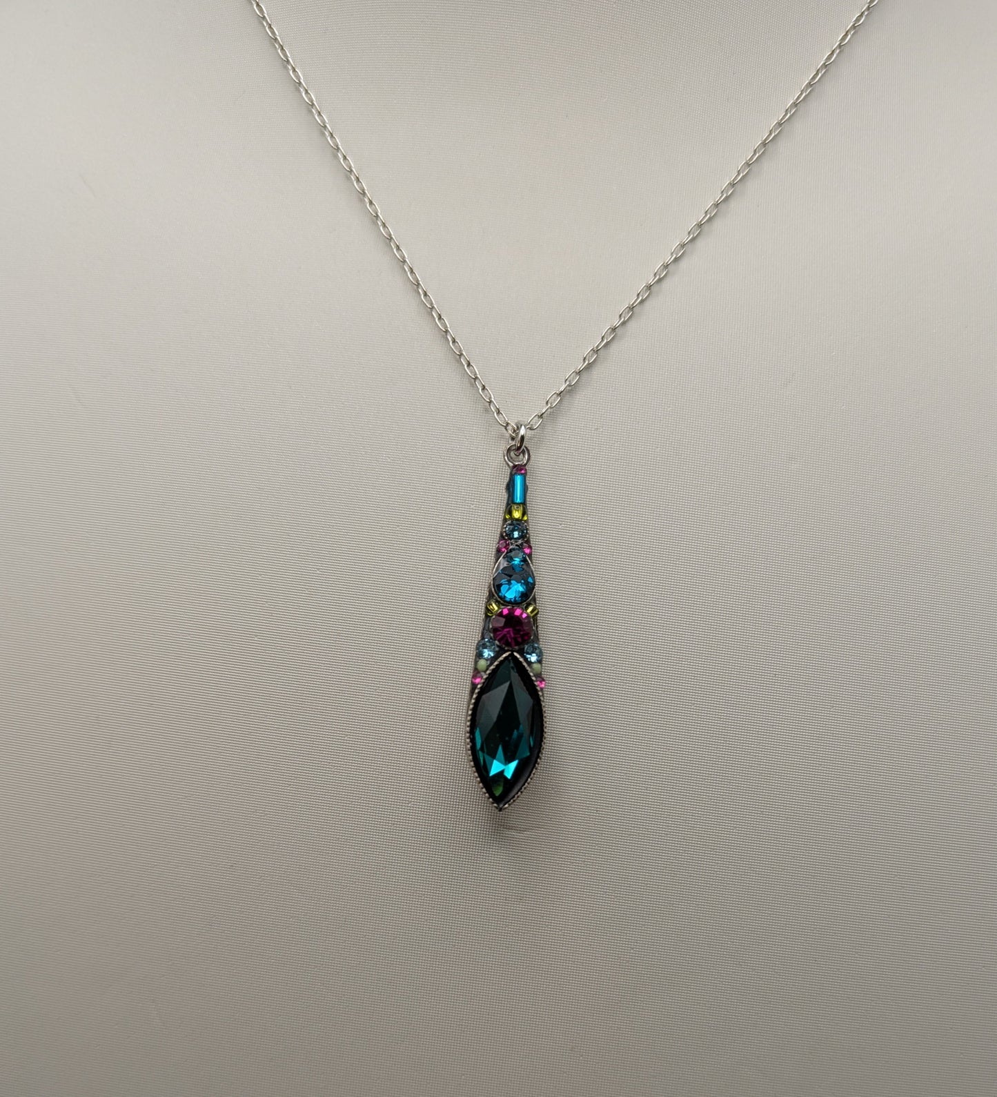 Necklace with a teardrop-shaped pendant on a light gray background