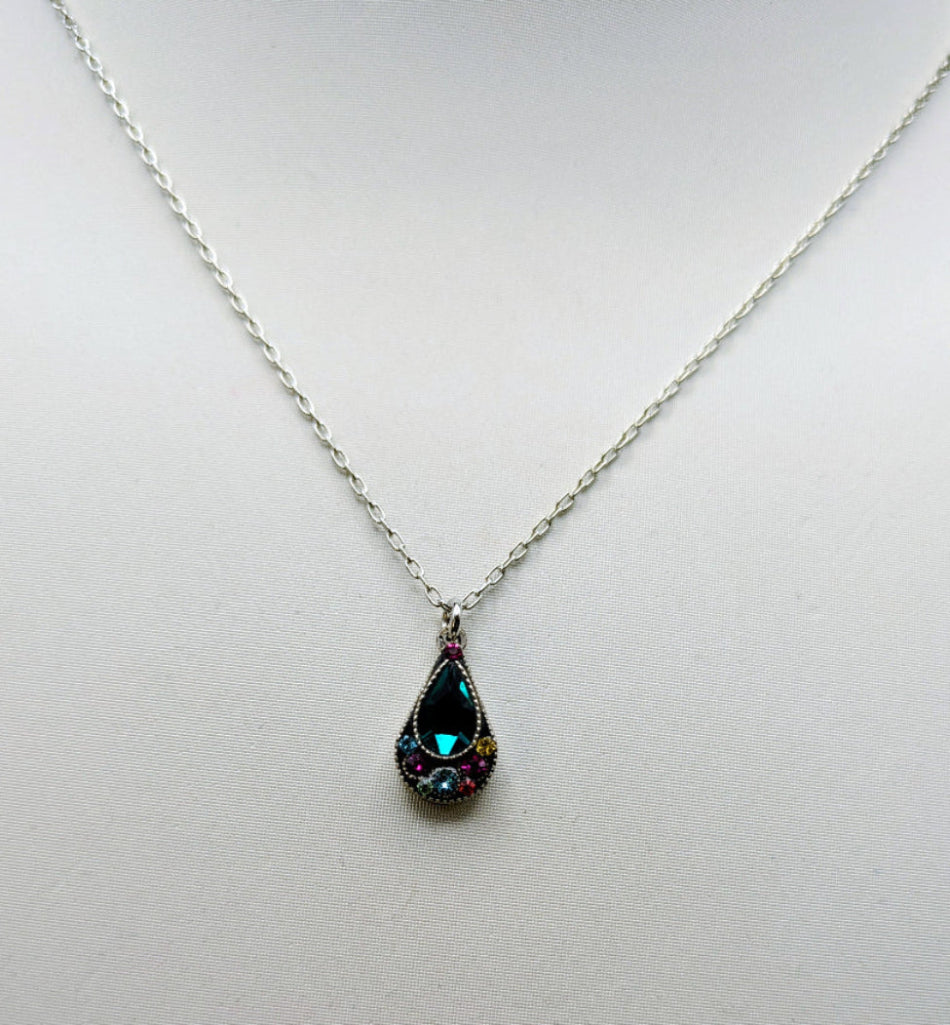 A silver chain necklace with a teardrop-shaped pendant featuring a dark green iridescent center stone surrounded by small pink and blue stones.