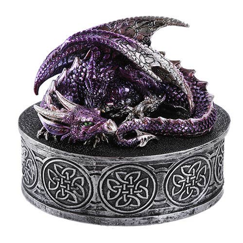 Purple dragon figurine on a decorative base with Celtic knot patterns