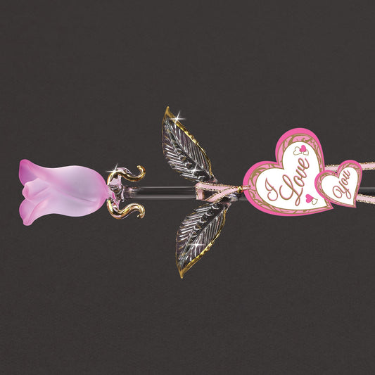Decorative bow with pink flower and 'I Love You' heart on a black background