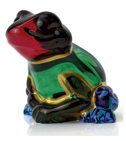 Colorful frog figurine on a white background