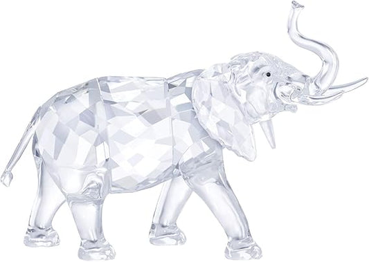 A clear crystal figurine of an elephant with a diamond-patterned surface.