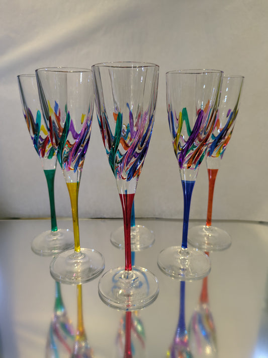A set of six multicolored wine glasses with a geometric pattern, displayed against a white background.