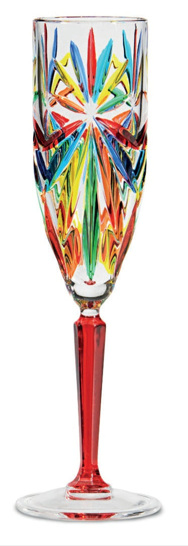A tall wine glass with a colorful geometric pattern on the bowl and a red stem and base.